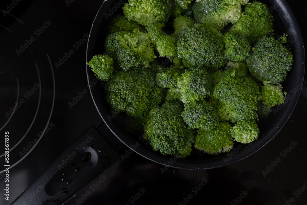 Dark green brocoli lying together grouped. Healthy diet and lyfestyle concept. Green vegetables background Dark green brocoli lying together grouped. Healthy diet and lyfestyle concept. Green vegetables background