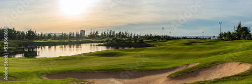BANNER LONG FORMAT, crop it. Orange dawn sun golf pond reflection hills green fabulous background