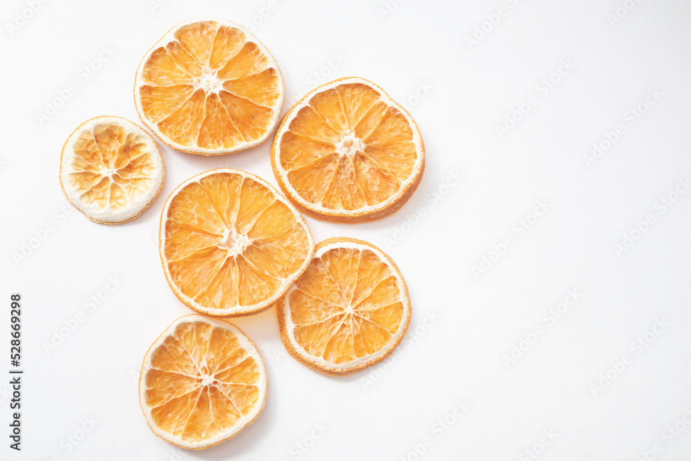 Round dried orange slices on a white background