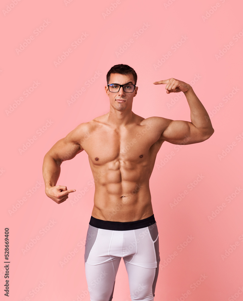 Fitness expert. Think with your head about your body. You are what you eat. Personal trainer and motivator. Muscular man athlete with glasses.