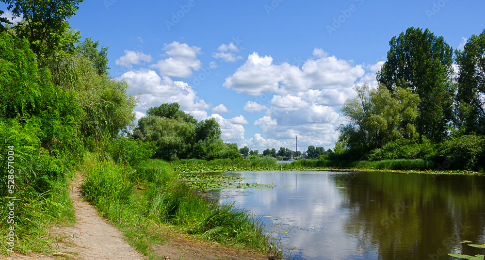 Dnepr River. Ukraine. A picturesque trail in the Obolonsky district of the city of Kyiv. Dnepr River. Ukraine. A picturesque trail in the Obolonsky district of the city of Kyiv.
