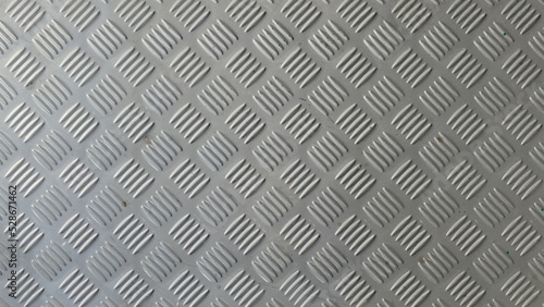Checker plate abstract floor metal stainless  steel texture background with reflection light. 