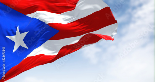 Fotografia Flag of Puerto Rico waving in the wind on a clear day