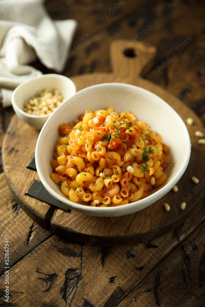 Pasta with tomato sauce and pine nuts Pasta with tomato sauce and pine nuts