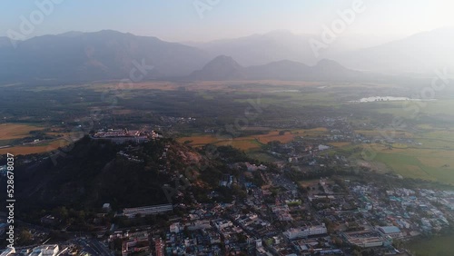 Aerial shot of sacred Hindu temple on hill in Palani, mountain background photo