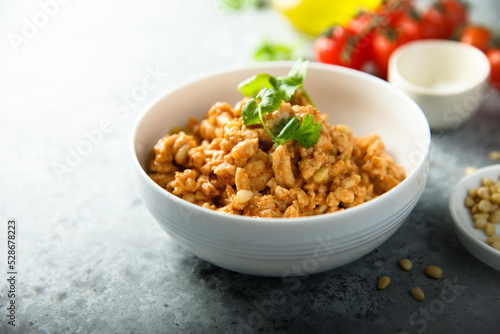 Homemade chicken ragout with pine nuts