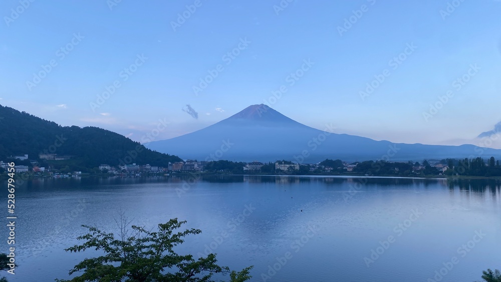 Magnificent Japanese traditional view, Mt Fuji at just after 5:30 am, the beautiful silhouette revealed in whole after cloudy evening the day before.  Photo taken year 2022 August 27th