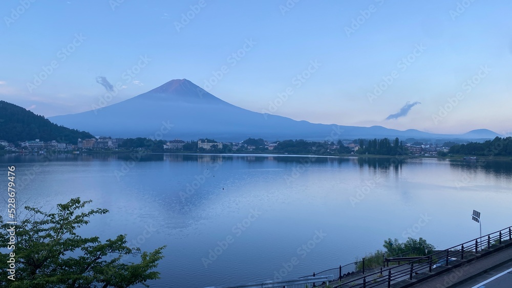 Magnificent Japanese traditional view, Mt Fuji at just after 5:30 am, the beautiful silhouette revealed in whole after cloudy evening the day before. Photo taken year 2022 August 27th Magnificent Japanese traditional view, Mt Fuji at just after 5:30 am, the beautiful silhouette revealed in whole after cloudy evening the day before. Photo taken year 2022 August 27th