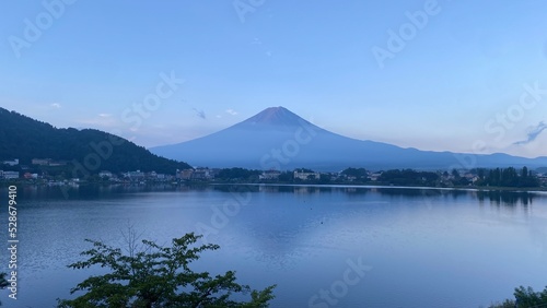 Magnificent Japanese traditional view  Mt Fuji at just after 5 30 am  the beautiful silhouette revealed in whole after cloudy evening the day before.  Photo taken year 2022 August 27th