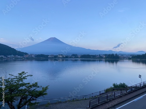Magnificent Japanese traditional view, Mt Fuji at just after 5:30 am, the beautiful silhouette revealed in whole after cloudy evening the day before. Photo taken year 2022 August 27th