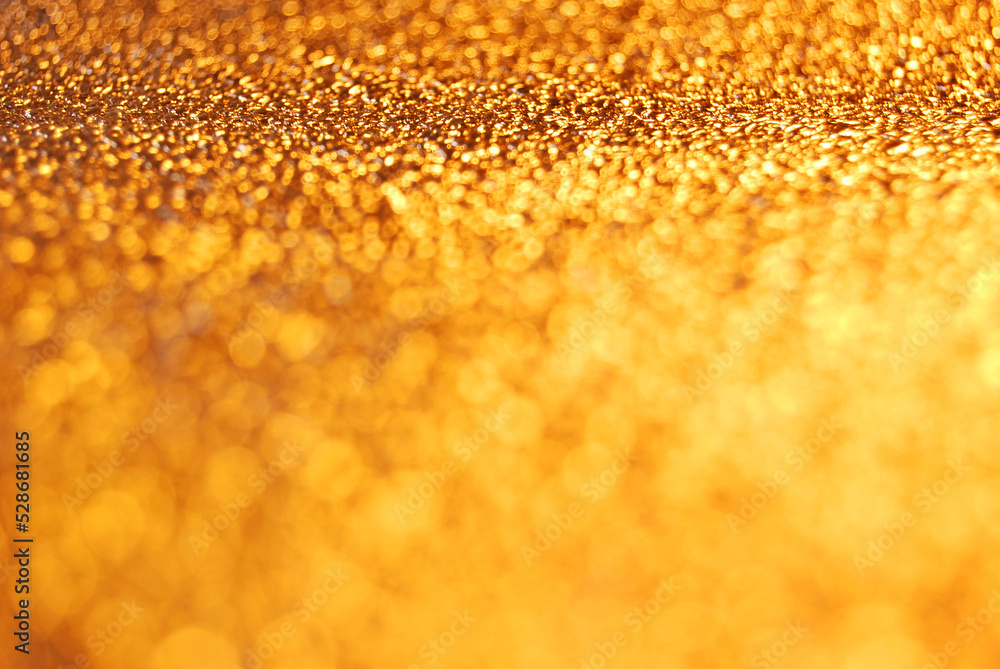Golden de focused sparkle glitter background close up Golden de focused sparkle glitter background close up