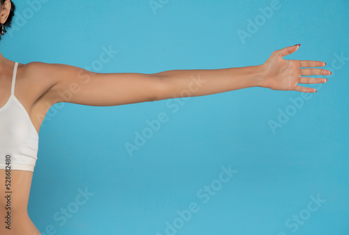 Fotografiet Young woman's stretched arm and palm