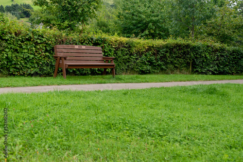 Park bench next to a footpath