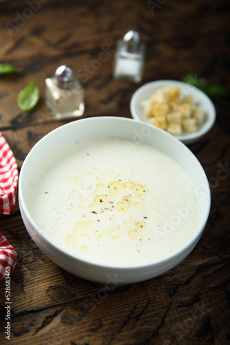 Traditional homemade cheese soup with croutons