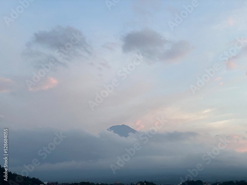 Lucky tip of Mount. Fuji showing up after 6 pm from Kawaguchiko lake, when we return there for “Obon” (lantern festival) season, year 2022 August 26th, Yamanashi prefecture of Japan