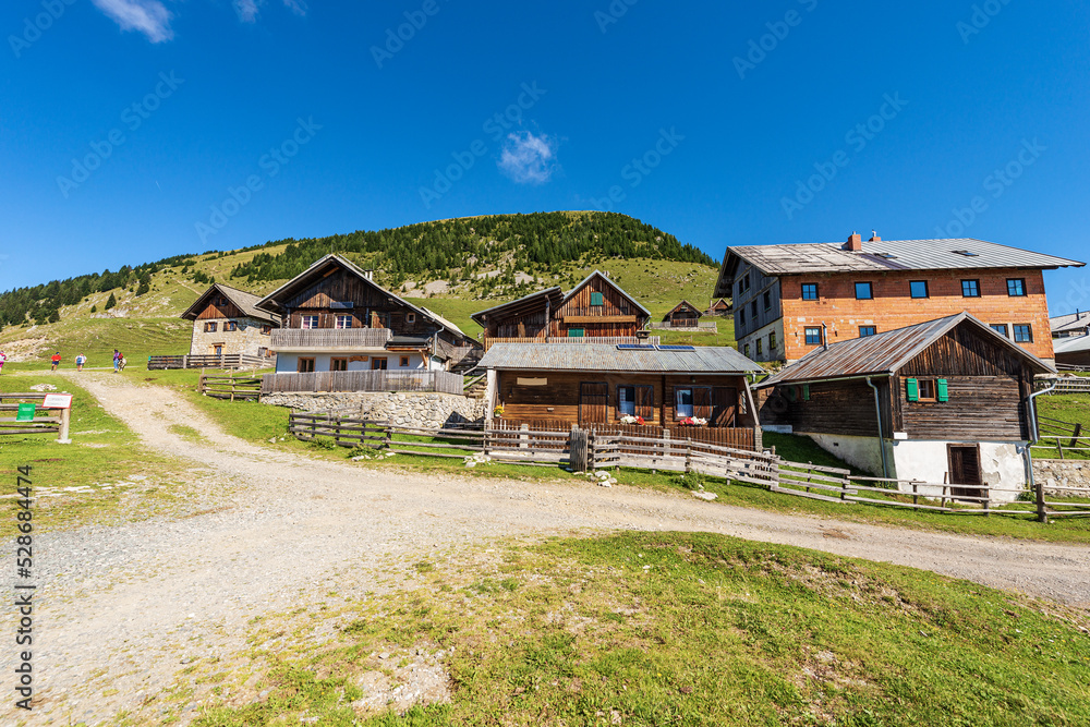Small village in the Carnic Alps and the mountain peak of Osternig or Oisternig, Italy-Austria Border. Feistritz an der Gail municipality, Carinthia, Austria, central Europe.