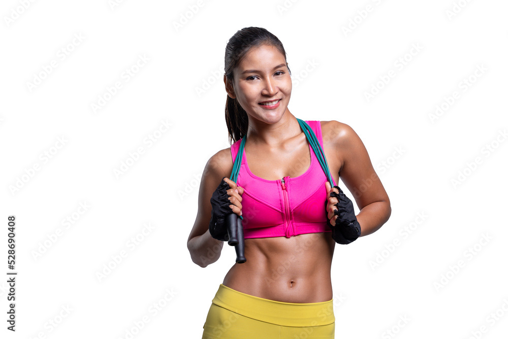 shot of smiling young sporty Asian woman fitness model in pink sportswear standing with a skipping rope. isolated on white background. Fitness and healthy lifestyle concept.