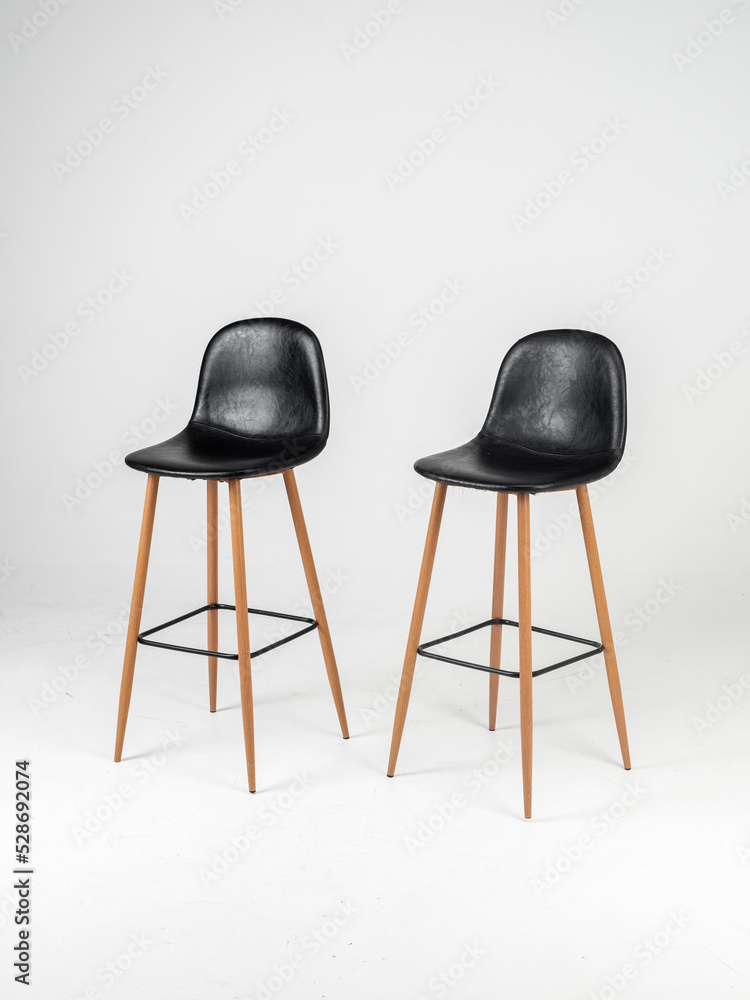 Black bar skin chairs with wood chair leg and black table on white background