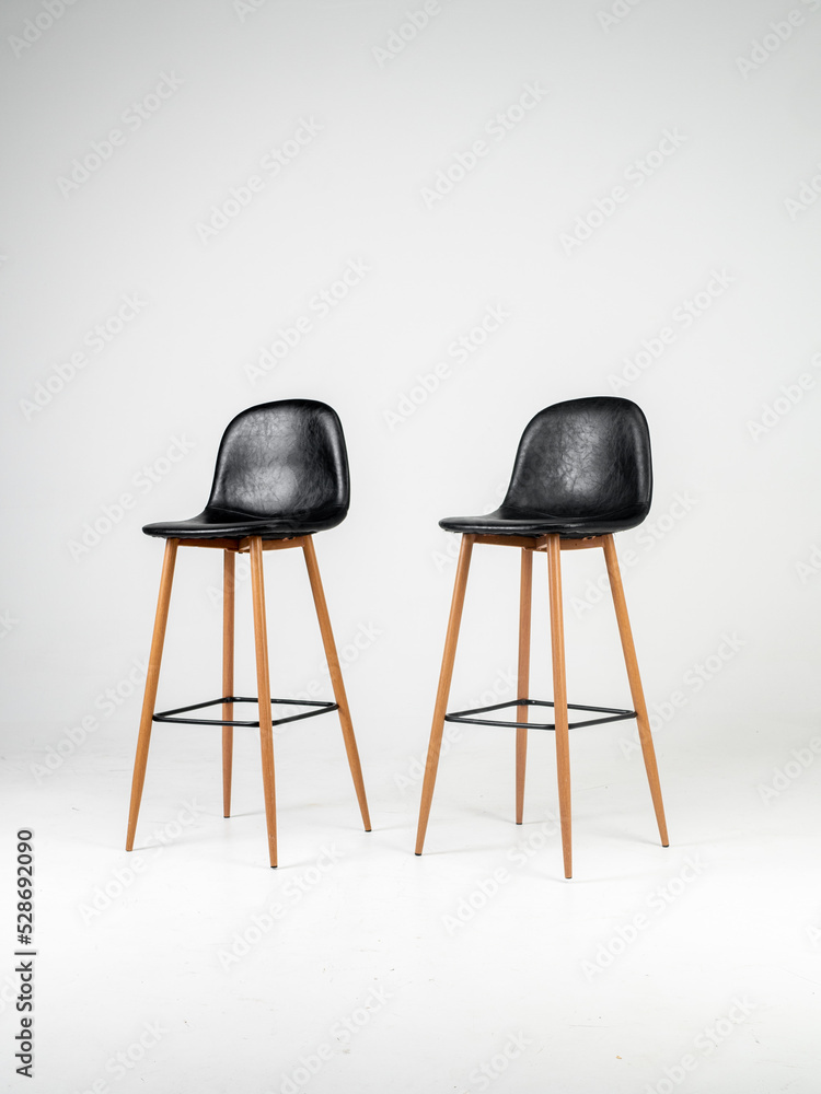 Black bar skin chairs with wood chair leg and black table on white background