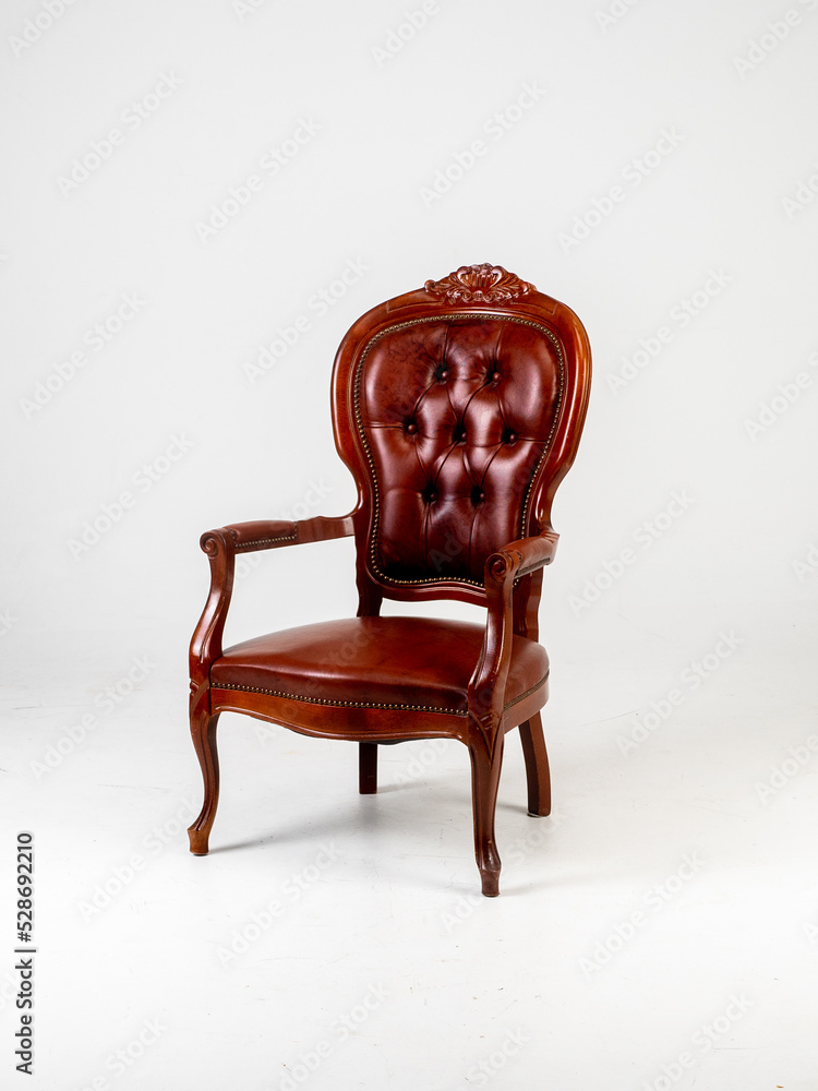 Old brown skin chair on white background