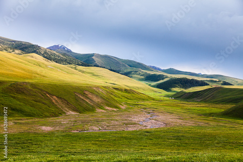 Obraz na płótnie Mountain river in the valley of the Assy plateau. Nomads live in yurts w salonie
