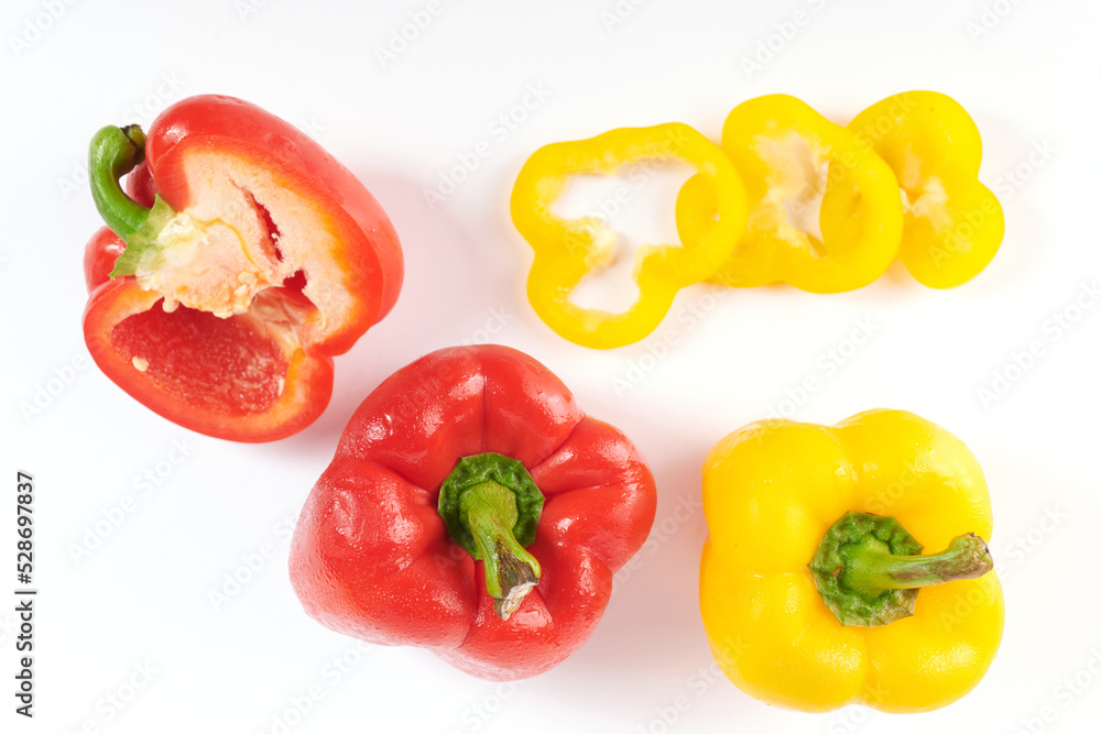 Ripe red and yellow bell peppers. Isolated on white background. Sweet pepper isolated on a white background. Ripe red and yellow bell peppers. Isolated on white background. Sweet pepper isolated on a white background.