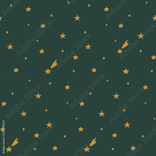 Seamless background with golden stars and comets with dots on green. Christmas or New Year pattern. Festive wrap