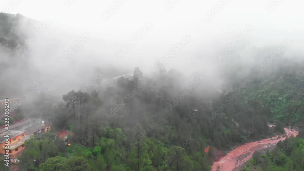 Aerial View Of Dense Mist Above Green Hillside In Punjab. Dolly Forward Aerial View Of Dense Mist Above Green Hillside In Punjab. Dolly Forward