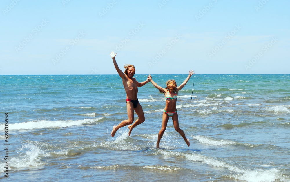 people jumping on the beach people jumping on the beach