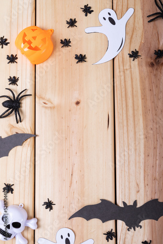 Close up view of multiple halloween toys with copy space on wooden surface