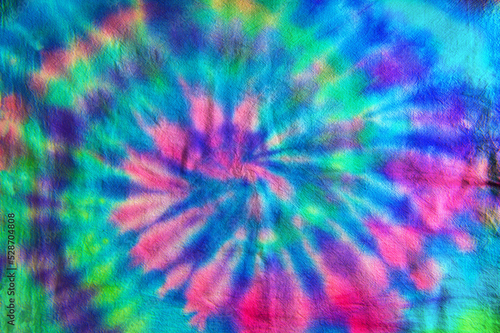 Swirl or Spiral pattern tie dye fabric in blue, green and magenta tones. Swirl or Spiral pattern tie dye fabric in blue, green and magenta tones.