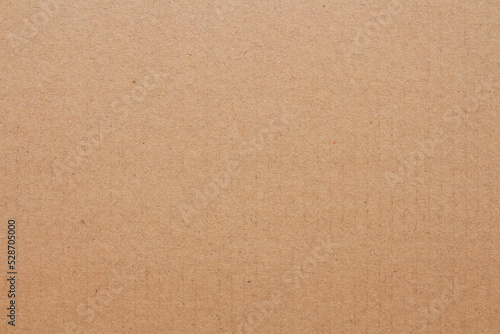 Cardboard sheet texture background, detail of recycle brown paper box pattern.