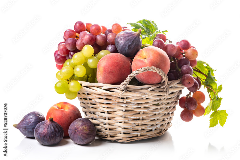 Fruit basket. Grapes, figs and peaches