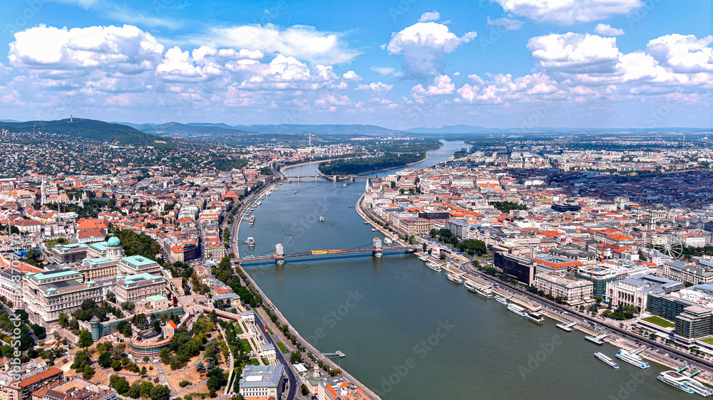 Obraz premium Budapest, Hungary aerial panoramic skyline view of Buda Castle Royal Palace with Szechenyi Chain Bridge, St.Stephen's Basilica, Hungarian Parliament and Matthias Church on a summer day with blue sky