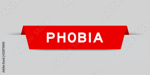 Red color inserted label with word phobia on gray background