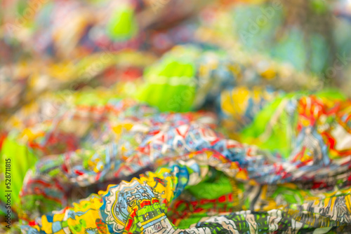 Multicolored corrugated fabric as a background. Lightweight material for scarves and summer wear. © Vera