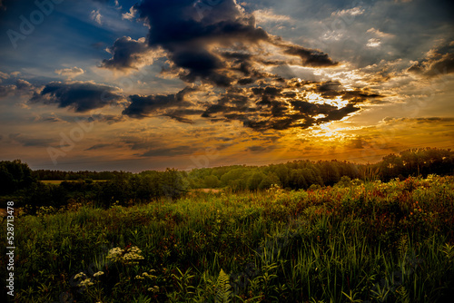 the sun behind the clouds