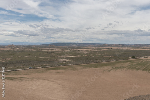 Badlans of Navarre (Bardenas Reales de Navarra) dessert in the middle of Spain. Aerial panorama.