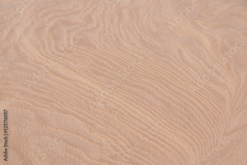 Top view on abstract pattern on the sand made by wind