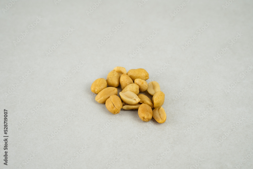 Peanuts on a plain grey background Peanuts on a plain grey background