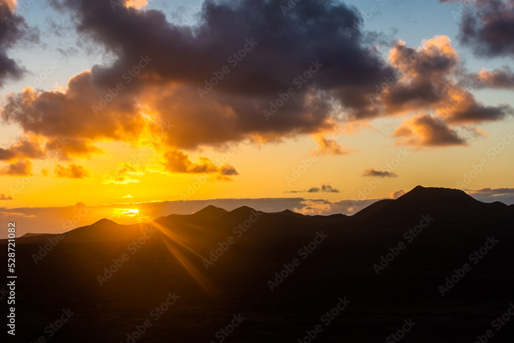 Obraz premium Amazing sunset over El Cuervo Volcano, in Lanzarote, Canary Islands, Spain