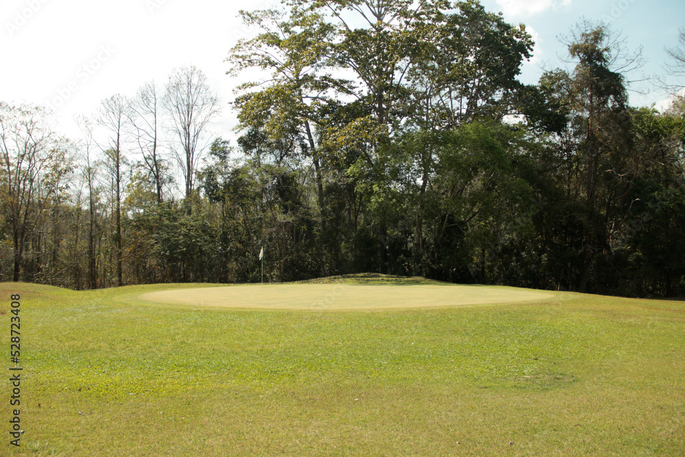 Naklejka premium Landscape of a beautiful golf course at the sunset in the countryside.
