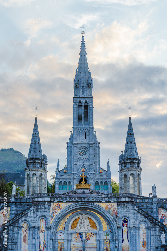 Lourdes, France. September 1, 2022. Front view of the Lourdes Sanctuary at dusk