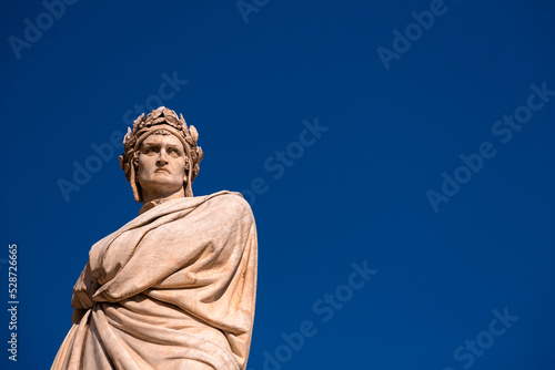 Fotografiet Marble statue of Dante Alighieri at the Santa Croce Square, Florence, Italy
