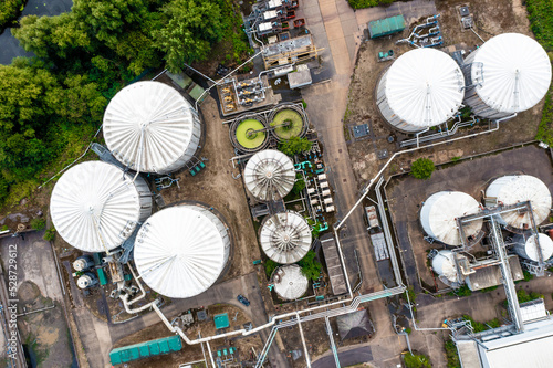 Aerial view directly above storage tanks and silos with connecting pipework