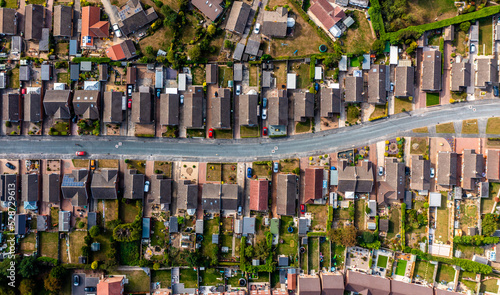 Aerial view directly above a road through a suburban housing estate