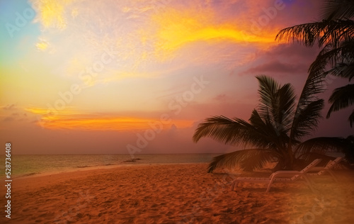 Beautiful blue red golden sunset. Colorful dawn over the sea. Nature beauty. Enjoying the sundawn with cloudy sky on the beach.