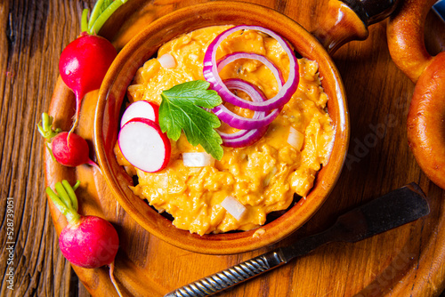 rustic Bavarian obazda with radishes and onions photo