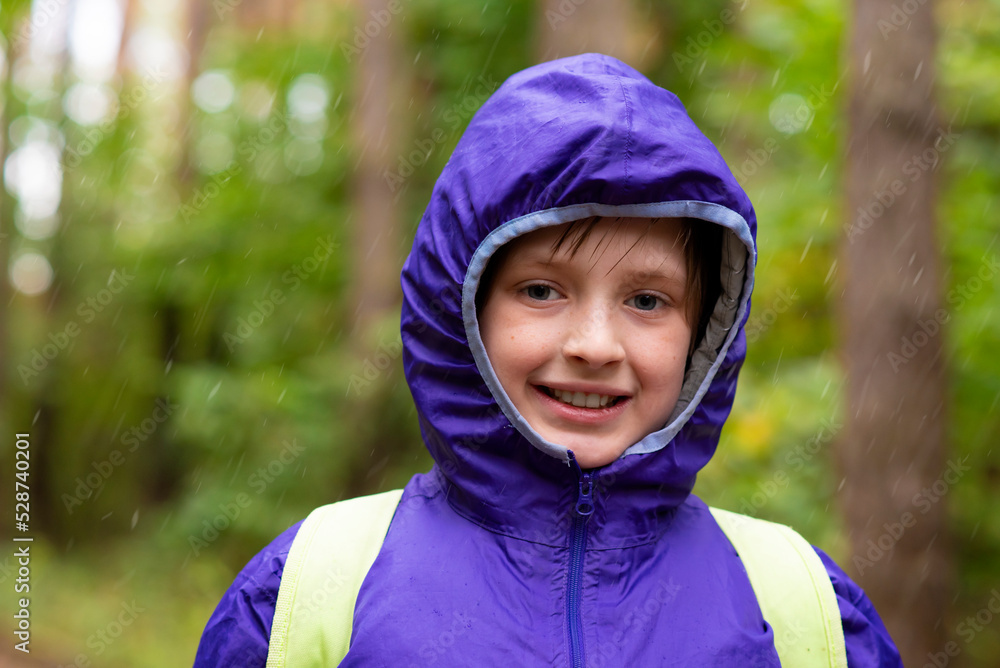 happy child walking on a rainy day in the forest happy child walking on a rainy day in the forest