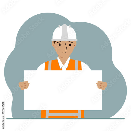 Engineer man holding a blank sheet of paper. The concept of a builder, engineer, planner or designer.